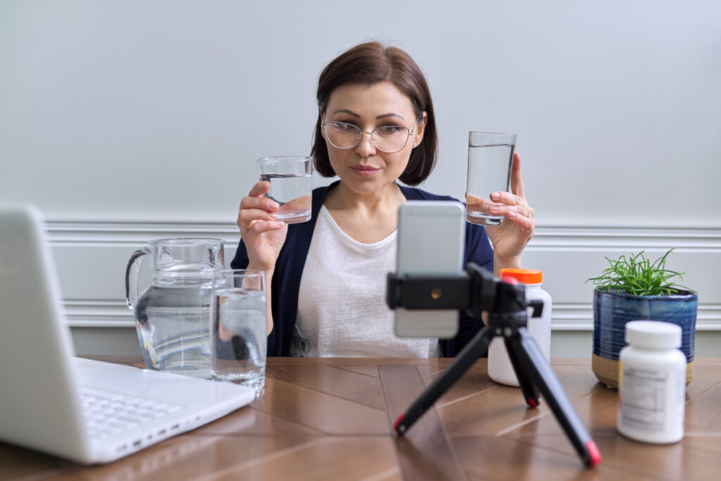 Nutritionist woman talking online about healthy eating, water, vitamins