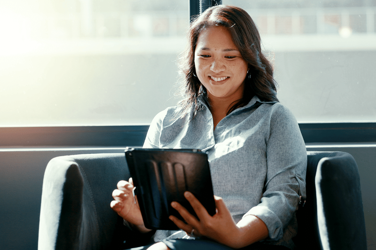 Woman checking her iPad to know what to do after you create a lead magnet