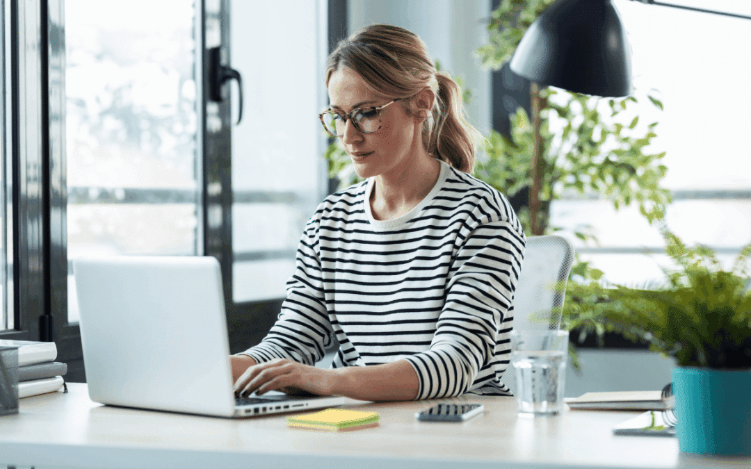 Mature woman working on a laptop while planning what to do after you create a lead magnet